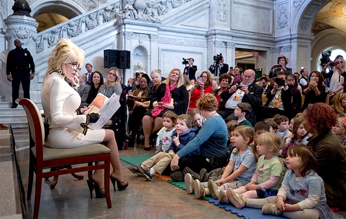 Dolly Parton Gives The Gift Of Literacy: A Library Of 100 Million Books